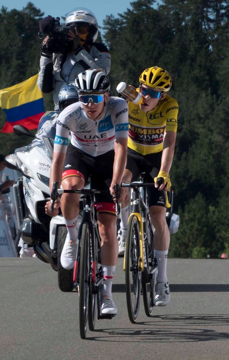 Tadej Pogačar and Jonas Vingegaard riding side by side at the Tour de France
