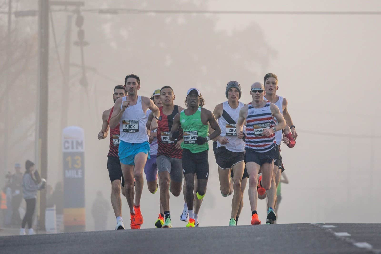 Athletics and Marathon, the classic endurance test. Runners on city bridge.Pexel